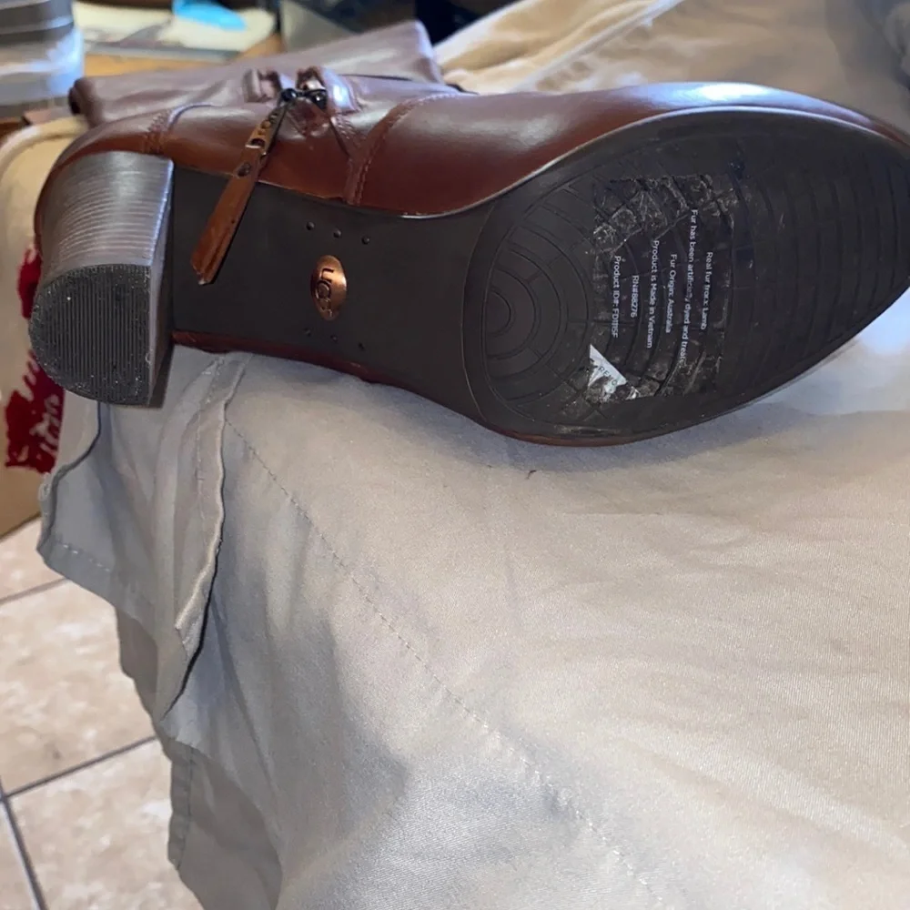 Never worn UGG leather knee high 4” heel with 1/2” platform